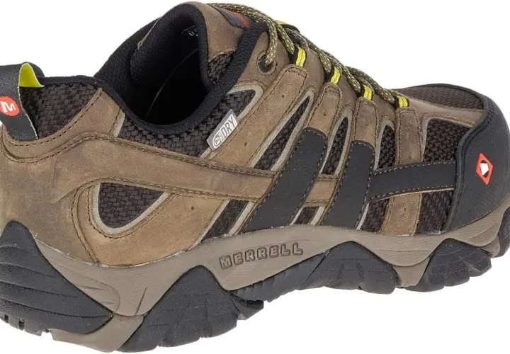 Brown Merrell Moab Vent hiking shoe with yellow laces and a "M-Dry" logo. Ready for any adventure!