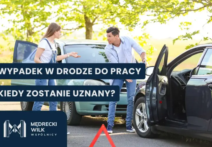 Dwie osoby rozmawiają przy uszkodzonych samochodach po wypadku drogowym.