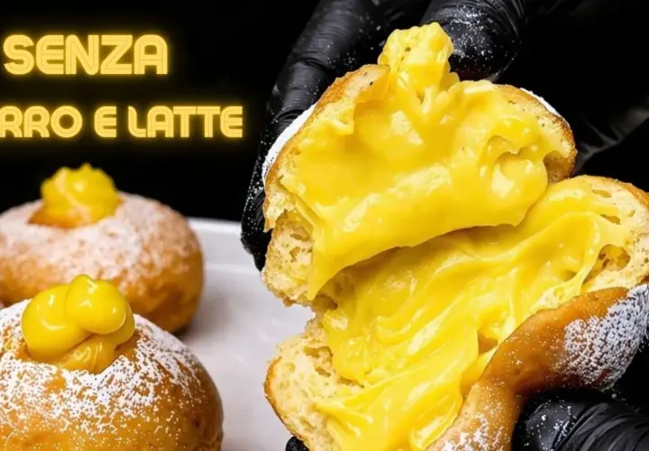 Bomboloni alla crema, soffici e ripieni, senza burro e latte. Un dolce invitante, pronto per essere gustato.