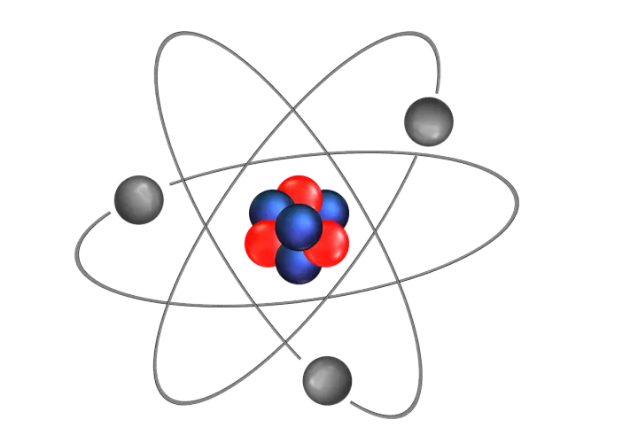 Schemat budowy atomu: jądro z czerwonych i niebieskich cząstek otoczone orbitującymi szarymi elektronami.