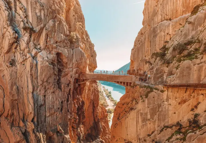 A breathtaking view of the Caminito del Rey, a famous walkway built into the side of a gorge, showcasing incredible walks in Spain.