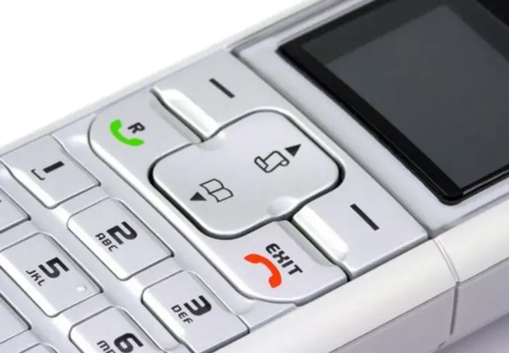 Telefon z klawiaturą numeryczną i przyciskiem "EXIT". Możesz nagrać wiadomość na poczta głosowa play.