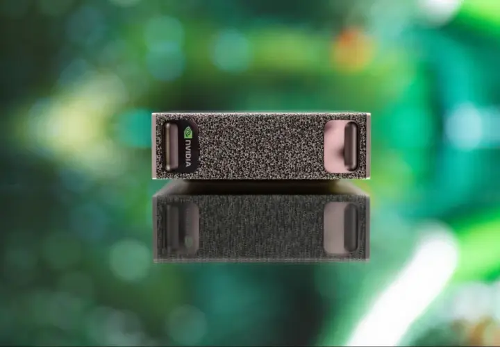 NVIDIA DGX Spark, kompaktowy moduł obliczeniowy, odbija się od błyszczącej powierzchni.
