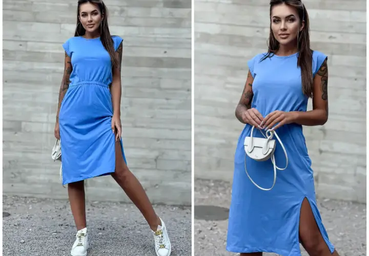 Kobieta w niebieskiej sukience i białych sneakersach. Idealne połączenie, jeśli zastanawiasz się, jakie buty do niebieskiej sukienki pasują na co dzień.