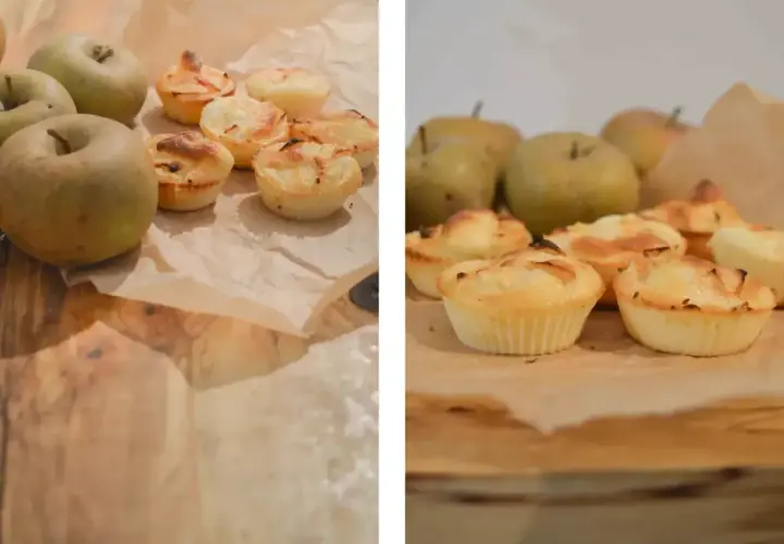 Pudełko na muffinki z jabłkami w tle. Słodkie wypieki wyglądają apetycznie.