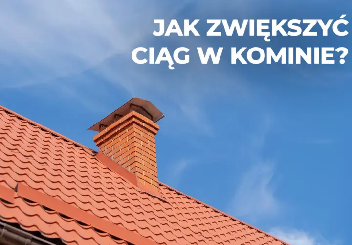 Ceglany komin na czerwonym dachu pod błękitnym niebem. Dowiedz się, jak poprawić ciąg w kominie, by ogrzewanie działało sprawniej.
