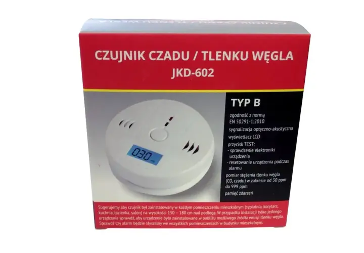 Biały czujnik czadu z wyświetlaczem LCD pokazującym "030" na tle czerwonego opakowania.
