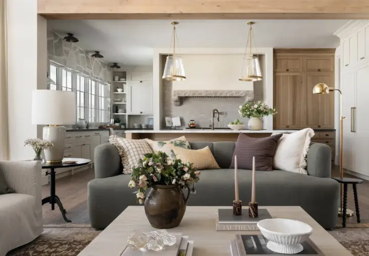A living room and kitchen blend in Studio McGee's signature style: cozy, layered textures, natural materials, and a neutral palette.
