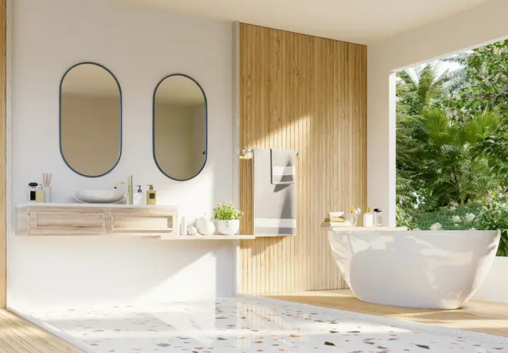 Modernt badrum med fristående badkar, dubbla speglar och trädetaljer. Golvet har en mönstrad design som visar skillnad på kakel och klinker.