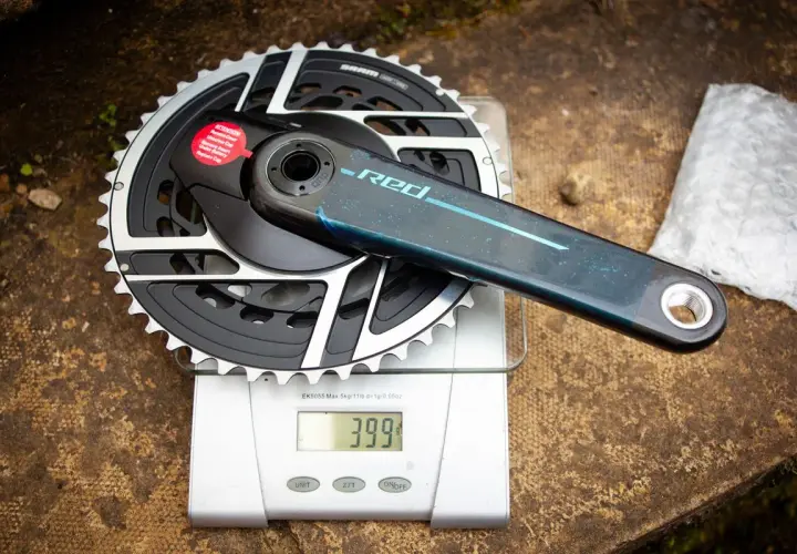 SRAM Red crankset weights 399g on a digital scale. This lightweight component is ready for performance cycling.
