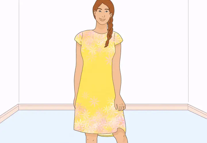 A woman in a yellow floral dress, ready to learn how to line a dress.