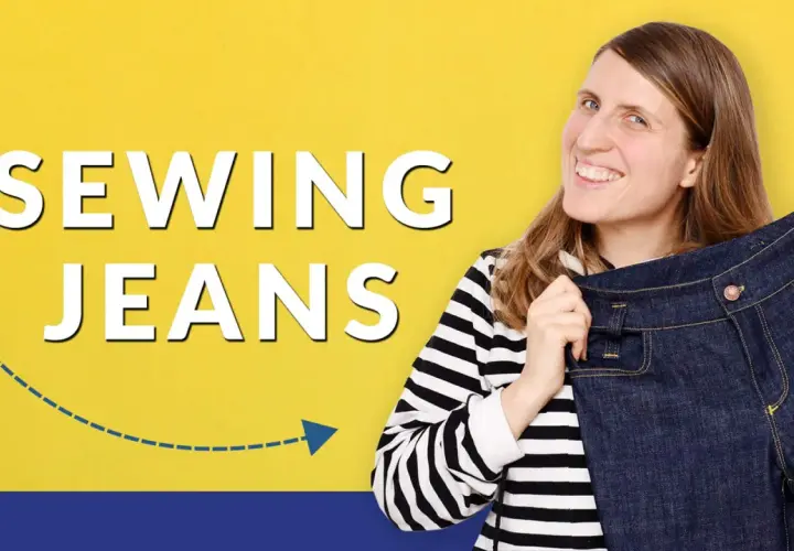 Woman smiles, holding up a pair of dark denim jeans, with "SEWING JEANS" text.