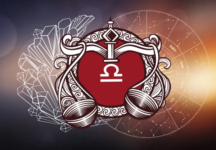 Symbol znaku zodiaku Waga, otoczony ozdobnymi elementami, kryształami i kołem zodiaku.