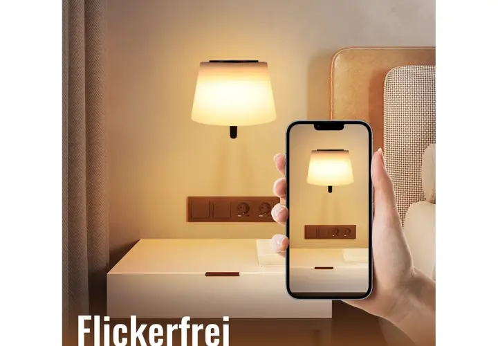Elegancki kinkiet nad stolikiem nocnym, widoczny na ekranie telefonu. Idealne oświetlenie do sypialni.