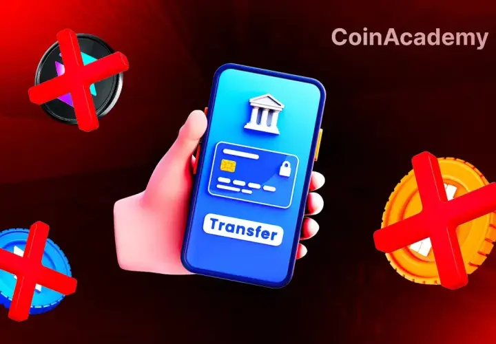 Main d'une personne tenant un smartphone affichant un virement bancaire bloqué. Des symboles de croix rouges sur des pièces suggèrent un problème avec les transactions N26.