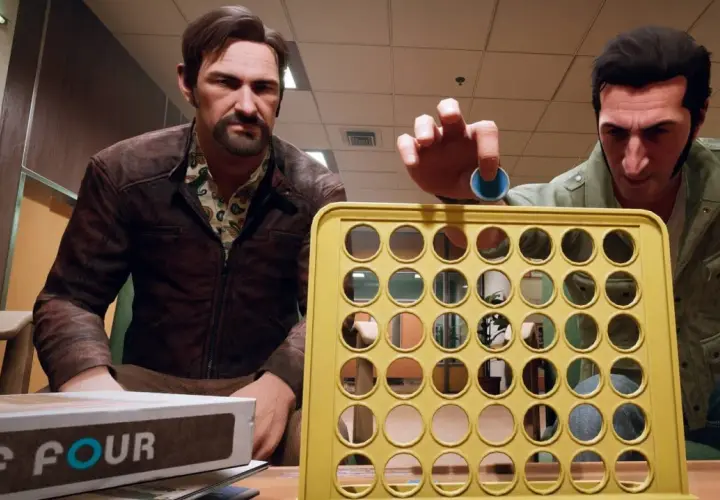 Dwóch mężczyzn gra w "Connect Four". Jeden z nich, w brązowej kurtce, patrzy na planszę. Drugi, w zielonej kurtce, właśnie wrzuca niebieski krążek. To może być ich "a way out spolszczenie".