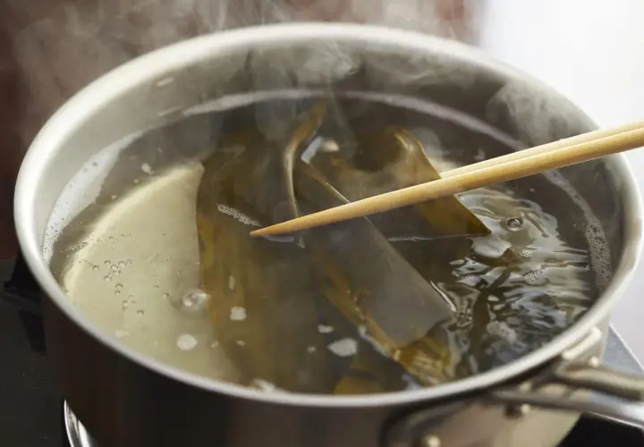 Kombu is steeped in simmering water, a key step for many delicious kombu recipes.