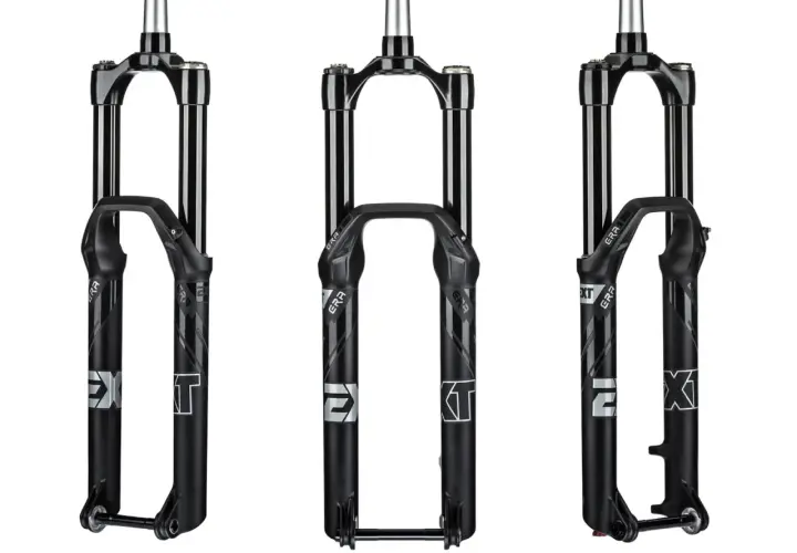 Three black EXT era bicycle forks are displayed.
