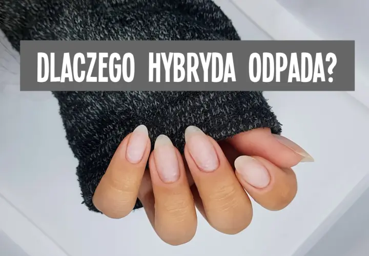 Dłonie w szarym swetrze, z widocznymi paznokciami. Napis: "DLACZEGO HYBRYDA ODPADA?". Nic mi się nie trzyma na paznokciach?