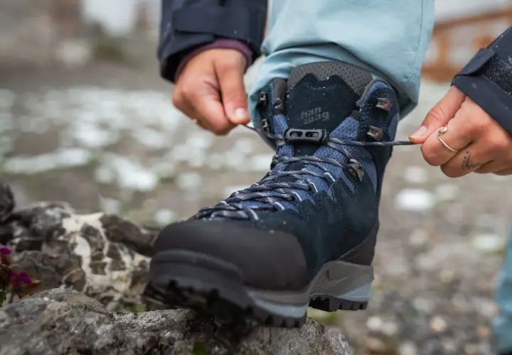 Lacing up new hiking boots. Wondering how long to break in shoes for comfort on the trail.