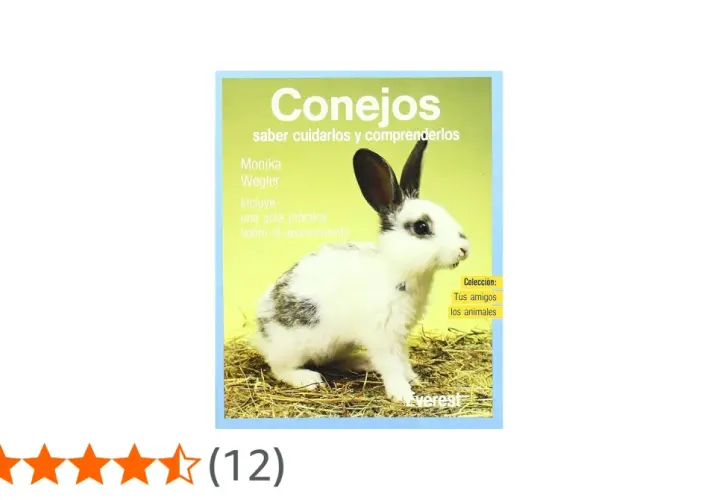Un conejo blanco y negro en un libro sobre qué comen los conejos y cómo cuidarlos.