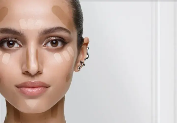 Ansikte med applicerad foundation och contouring för att skapa djup och framhäva drag. En guide till hur man får glow i ansiktet.