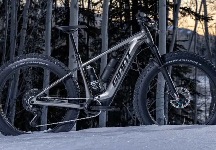 A **Giant Yukon mtn bike** with fat tires sits in the snow, ready to conquer winter trails.