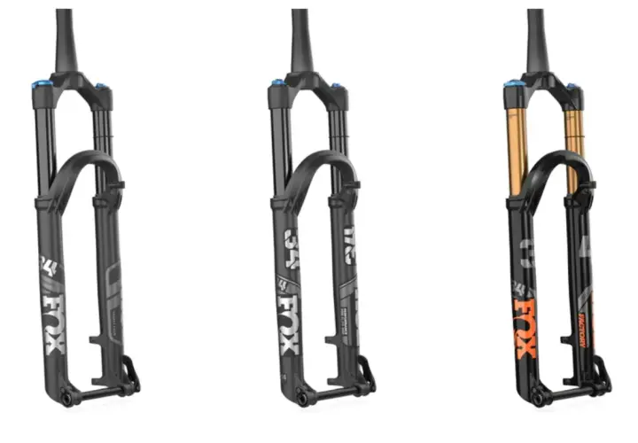 Three Fox suspension forks: two black Performance models and one black Factory model with gold stanchions, showcasing the difference between Fox Factory vs Performance.