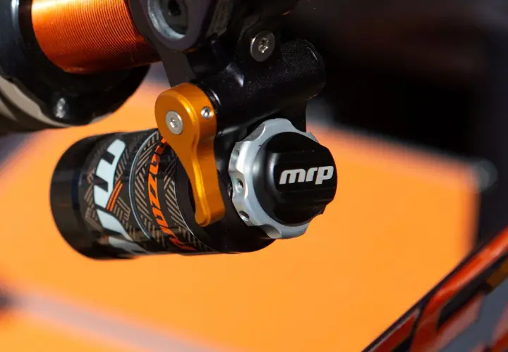 Close-up of a bicycle shock absorber with an "mrp" logo, part of a mrp hazzard review.