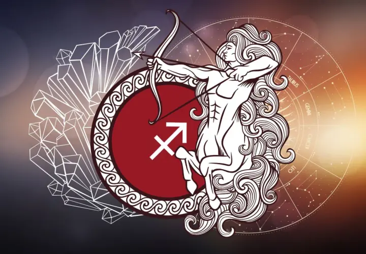 Strzelec znak zodiaku charakterystyka: centaur z łukiem i strzałą, symbol strzelca, kryształy i koło zodiaku.