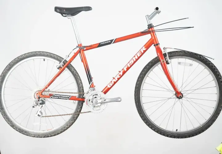 A vintage red Gary Fisher Piranha mountain bike, ready for adventure.