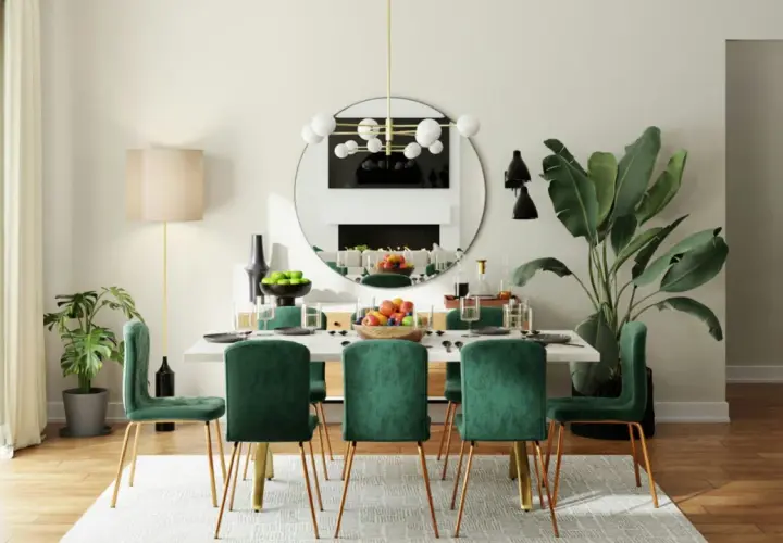 Salle à manger moderne avec six chaises en velours vert émeraude et une table blanche, parfaite pour une dimension salle à manger 8 personnes.