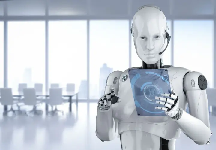 Robot z interfejsem dotykowym w nowoczesnym biurze. Czy sztuczna inteligencja to szansa czy zagrożenie dla przyszłości?