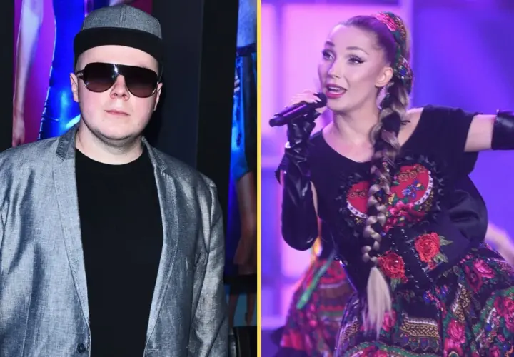 Donatan i Cleo na scenie. Donatan w szarej marynarce i czapce, Cleo w tradycyjnej sukni z haftem.