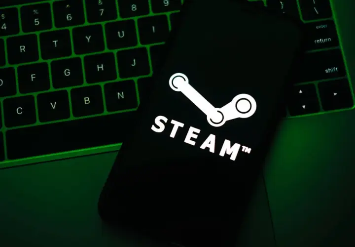 Telefon z logo Steam na klawiaturze. Dowiedz się, jak zarobić na Steam, grając lub sprzedając przedmioty.