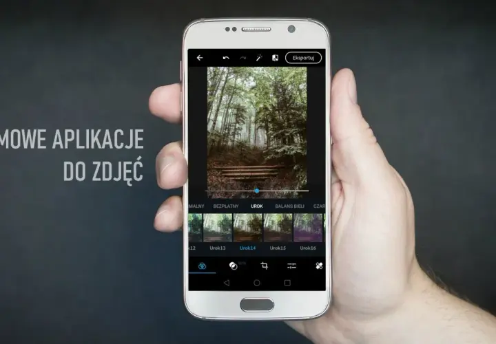 Dłoń trzyma smartfon z aplikacją do edycji zdjęć. Na ekranie widać leśny krajobraz i dostępne filtry, idealne dla fotografów szukających darmowych aplikacji.