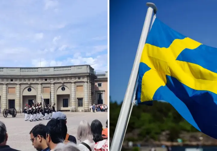 Vaktparad vid slottet i Stockholm på nationaldagen. Svenska flaggan vajar stolt i vinden.