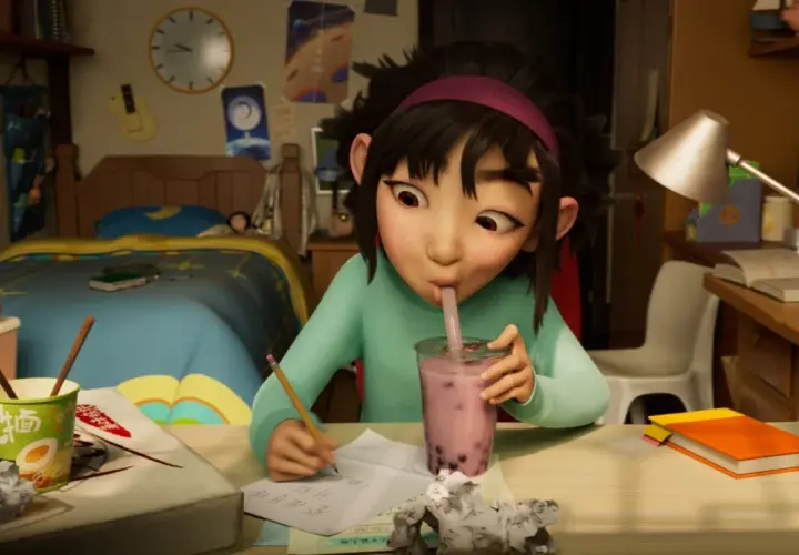 Dziewczynka pije bubble tea, pisząc wypracowanie. Może to jedna z bajek na Netflixie, która inspiruje do nauki i marzeń.