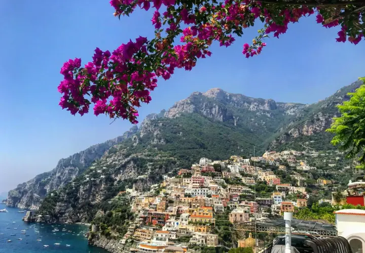 A stunning view of Positano, a colorful cliffside village on the Amalfi Coast, perfect after your trip from Naples airport.