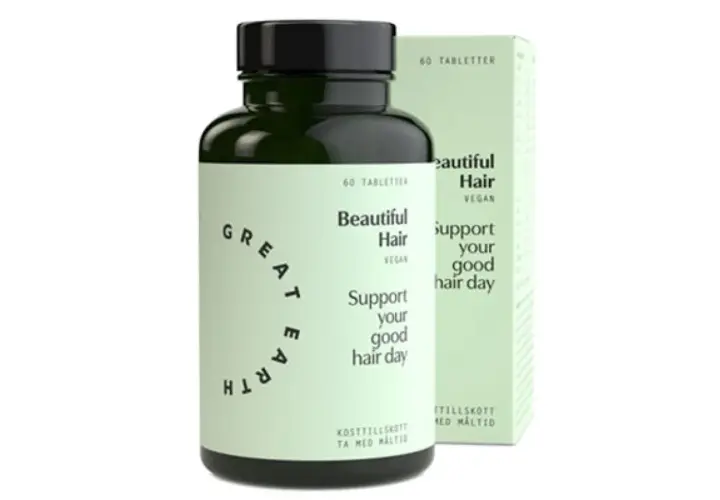 En flaska och en kartong med "Beautiful Hair" hår vitaminer. Stöd ditt goda hår-dag med dessa veganska kosttillskott.