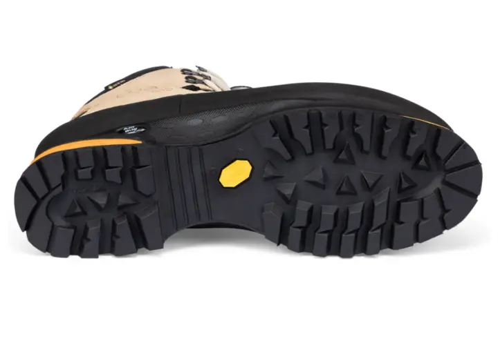 A hiking boot with a deep lug Vibram sole. While hairspray might make shoes non-slip temporarily, this boot's tread is designed for serious grip.