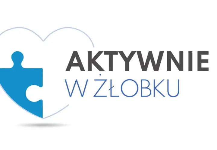 Niebieski element puzzla w kształcie serca z napisem "AKTYWNIE W ŻŁOBKU". Dofinansowanie do żłobka ułatwia rodzicom powrót do pracy.