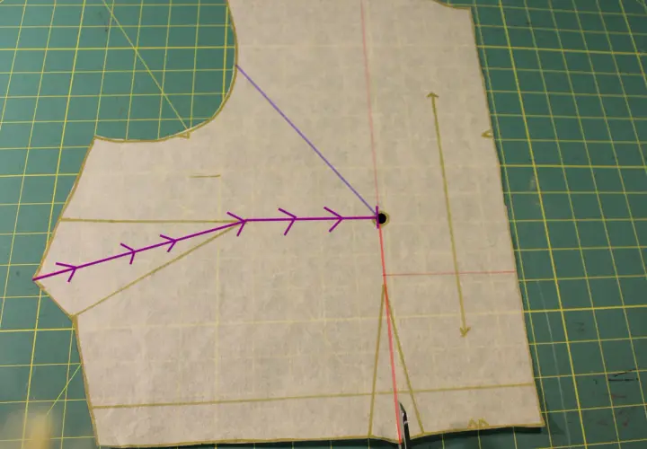 Sewing pattern piece showing how to shape bust darts. Purple arrows indicate the direction of the dart manipulation.