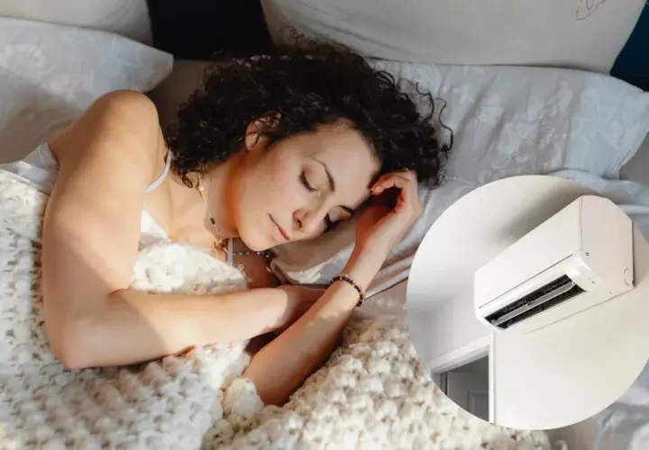 Mujer durmiendo plácidamente bajo una manta, con el aire acondicionado a 22 grados creando un ambiente perfecto para el descanso.