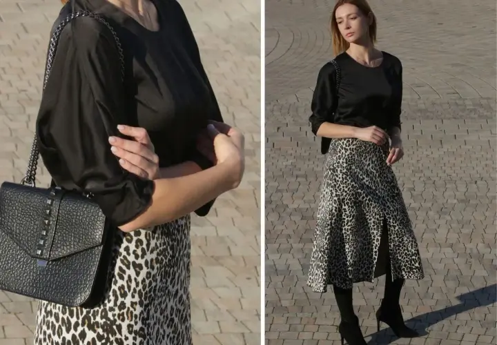 Elegancka czarna bluzka do spódnicy w panterkę, idealna na co dzień i wieczór. Stylizacja z czarną torebką na łańcuszku.