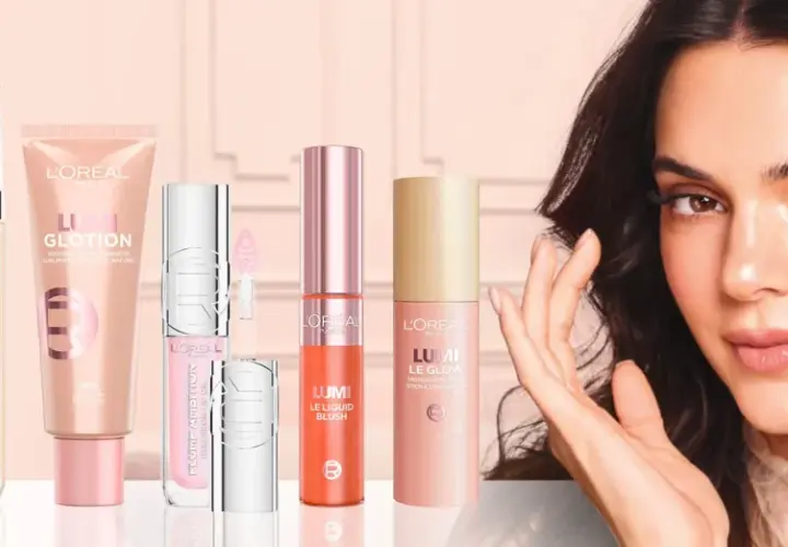 En kvinna med en strålande glow, omgiven av L'Oréal-produkter som True Match Nude, Lumi Glotion och Lumi Le Glow.