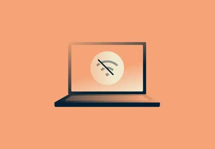 Laptop z symbolem przekreślonego Wi-Fi. Brak internetu uniemożliwia pracę.