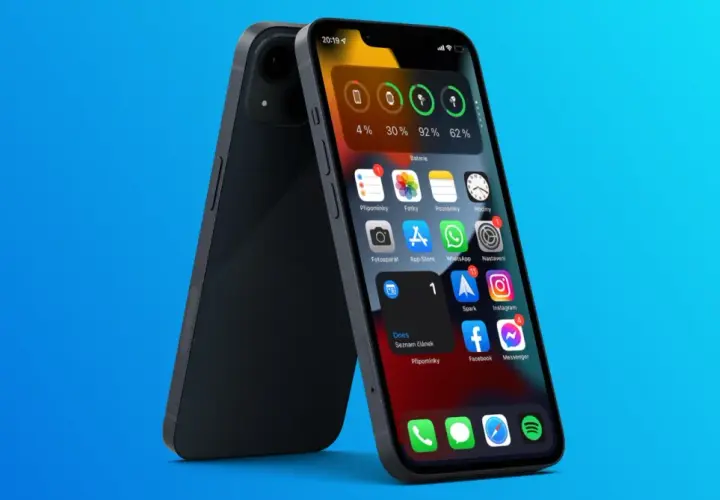 Ekran główny iPhone z widocznymi ikonami aplikacji i widżetem baterii.