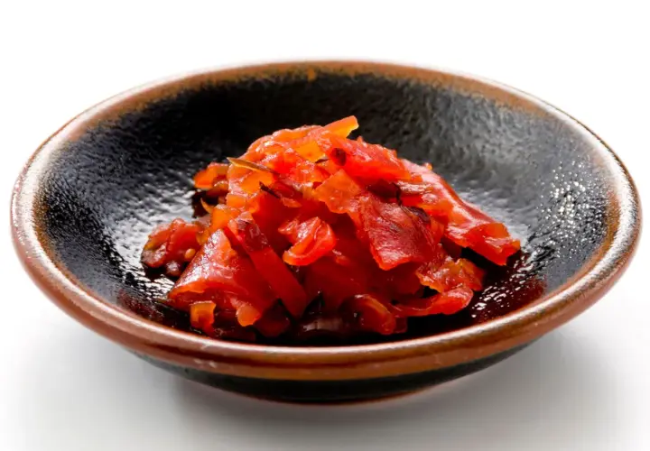 A small bowl of bright red fukujinzuke, a relish often served with Japanese curry. This image could be part of a fukujinzuke recipe.