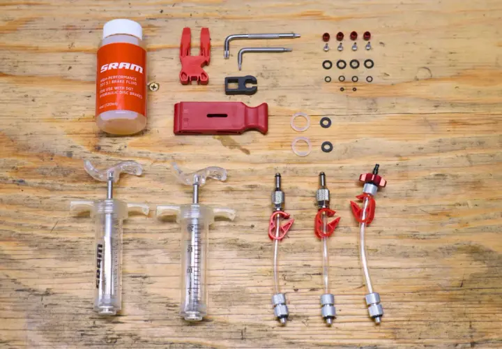 SRAM brake flush and bleed kit with syringes, fluid, and tools. Essential for maintaining hydraulic disc brakes.